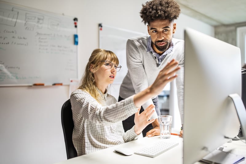 marketers at a computer